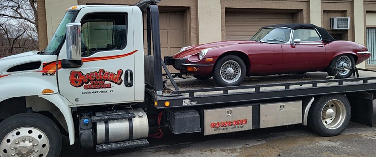 Overland Tow Service hauling a classic car in Olathe, KS